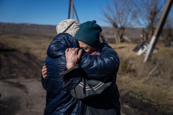 Image from Ukraine - An elderly woman embraces her daughter, who has chosen to...