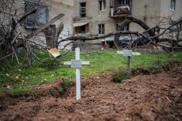 Image from Ukraine - Makeshift crosses mark two graves of people buried in...
