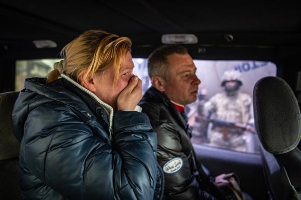 Image from Ukraine - A married couple sitting in a car look out at the...