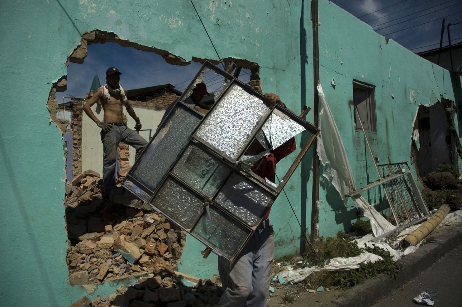 Flesh and Rocks  -  A group of laborers demolish an old house, where people...