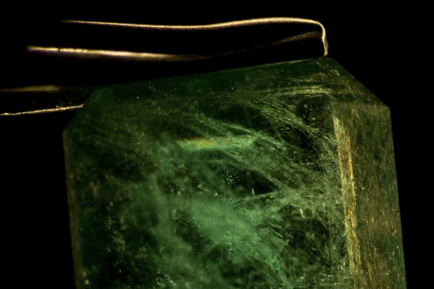 Flesh and Rocks  -  An emerald seen through a microscope at the headquarters...