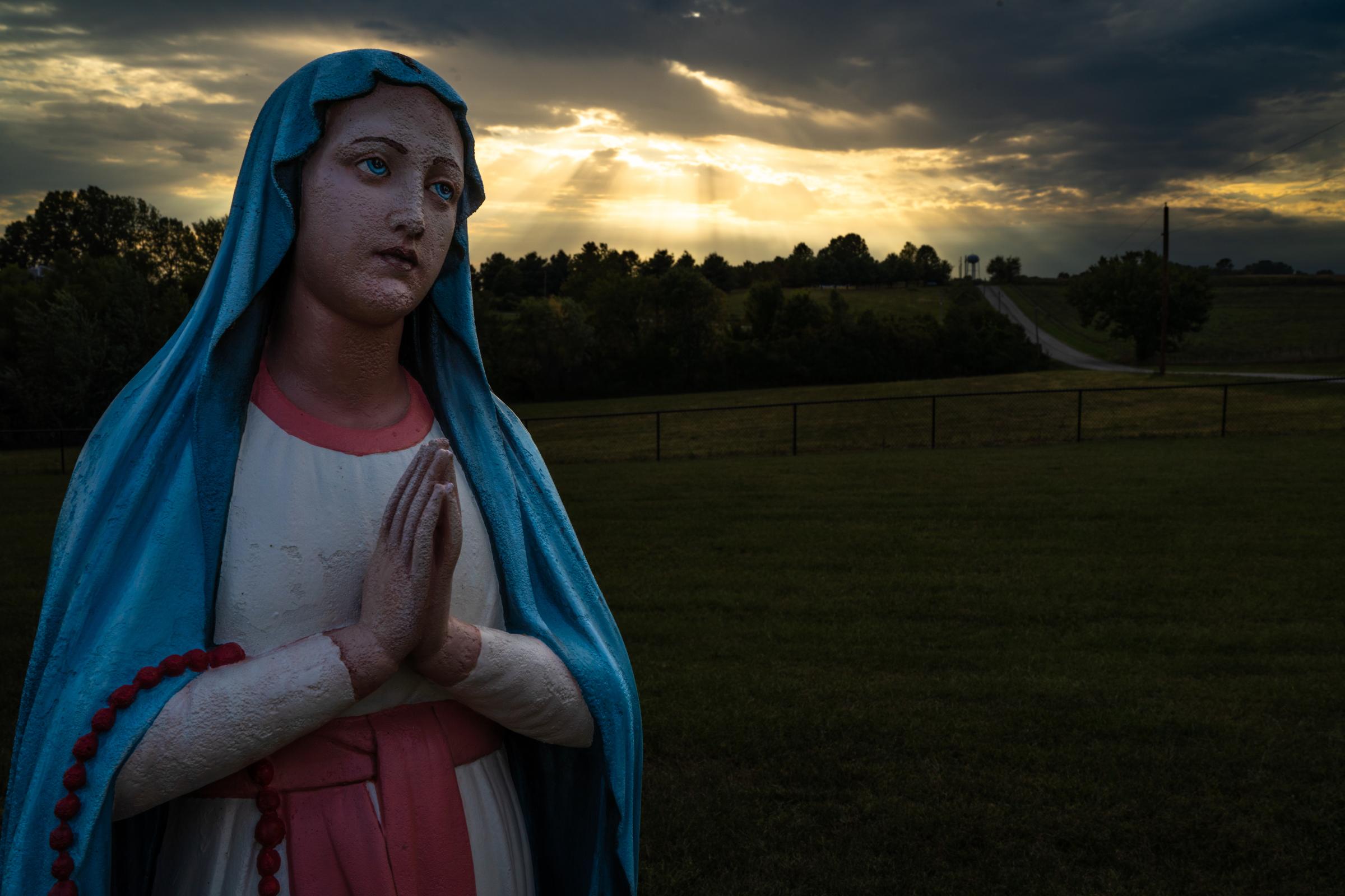 A House Full of Blessings - A statue of a prayerful Mother Mary greets guests just...