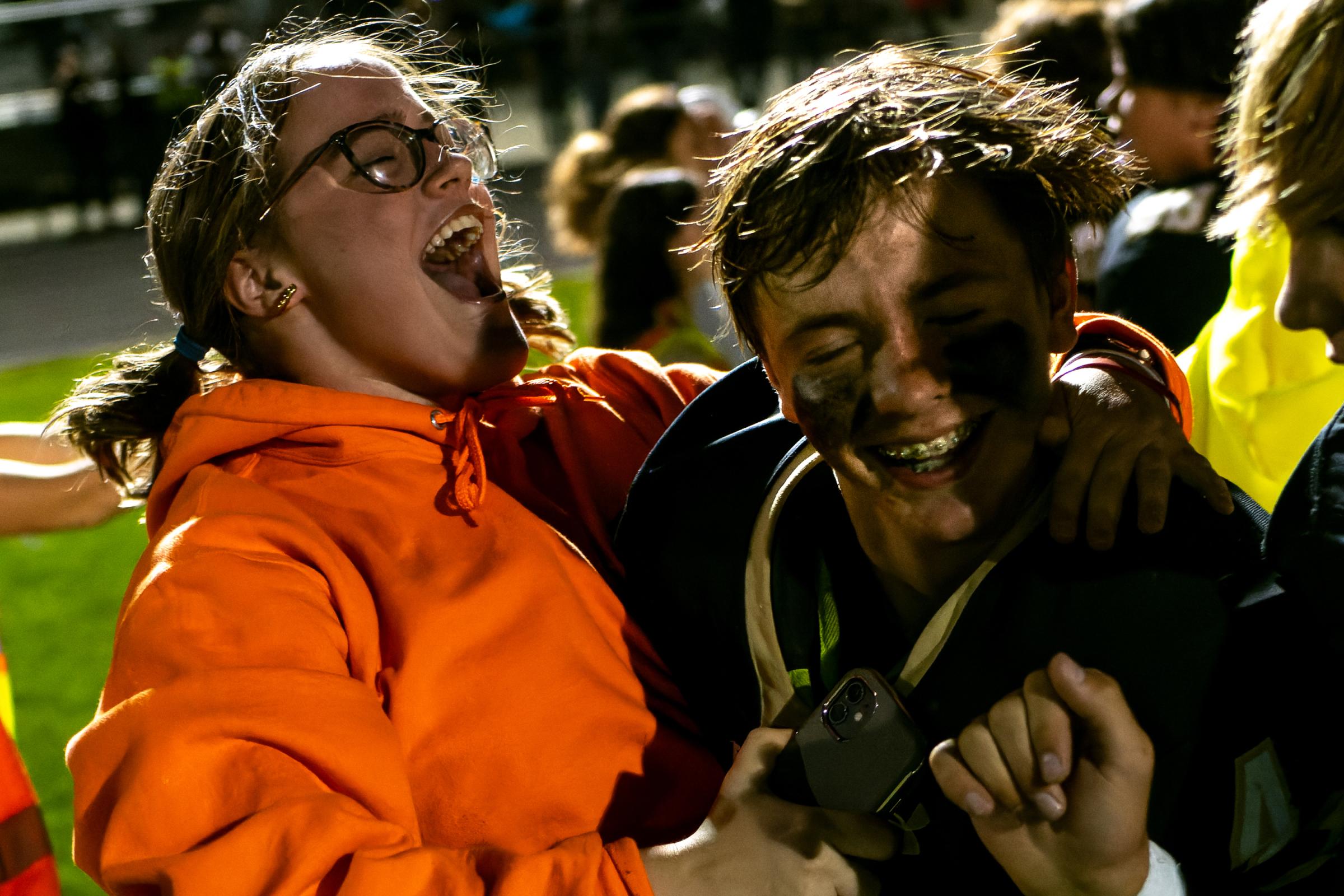 Sports - Grace McCorkle, left, cheers with Zayne Huber following...