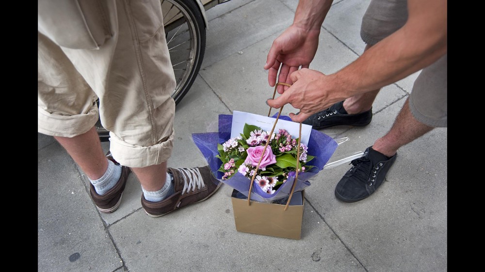 Julian Sayarer collects flowers before a delivery