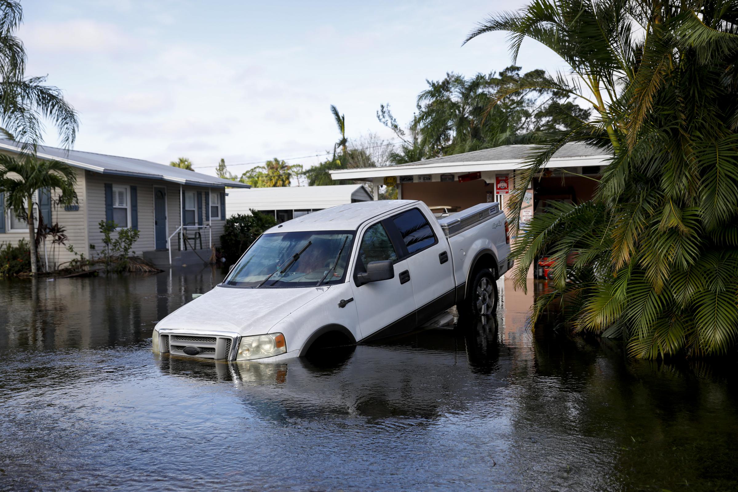 2022 - Hurricane Ian - A car partially flooded following Hurricane Ian in Fort...