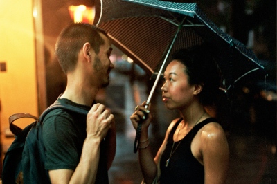 Image from A Banner Year -  Bob and Monica in the rain on 3rd Avenue, New York, NY 