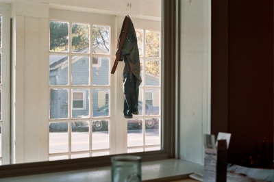 Image from A Banner Year -  Peter's pants in the window, Salem, NY 
