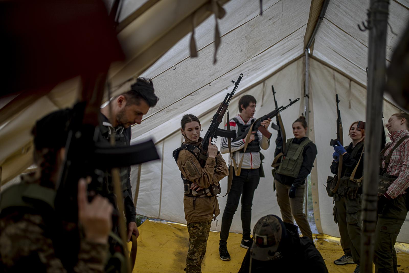 Defenders in training: empowering Ukrainian civilians amidst ongoing war - KYIV REGION, UKRAINE - July 22, 2023: Civilians with...