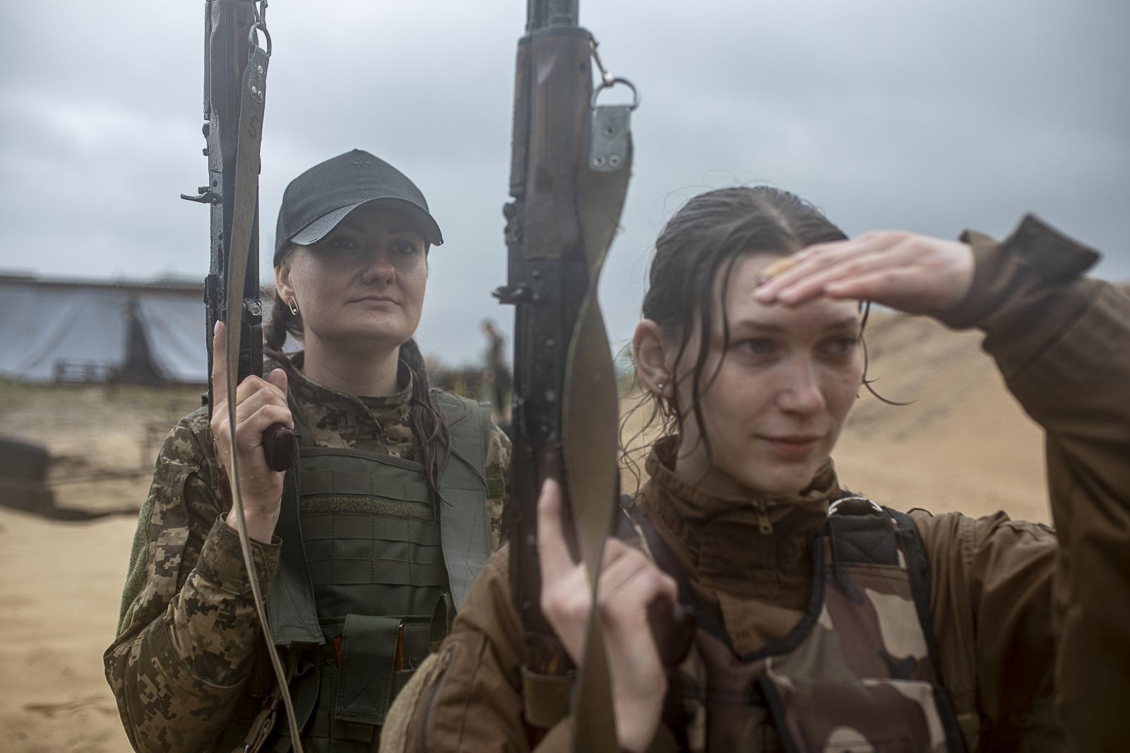 Defenders in training: empowering Ukrainian civilians amidst ongoing war - KYIV REGION, UKRAINE - July 22, 2023: Two women are...