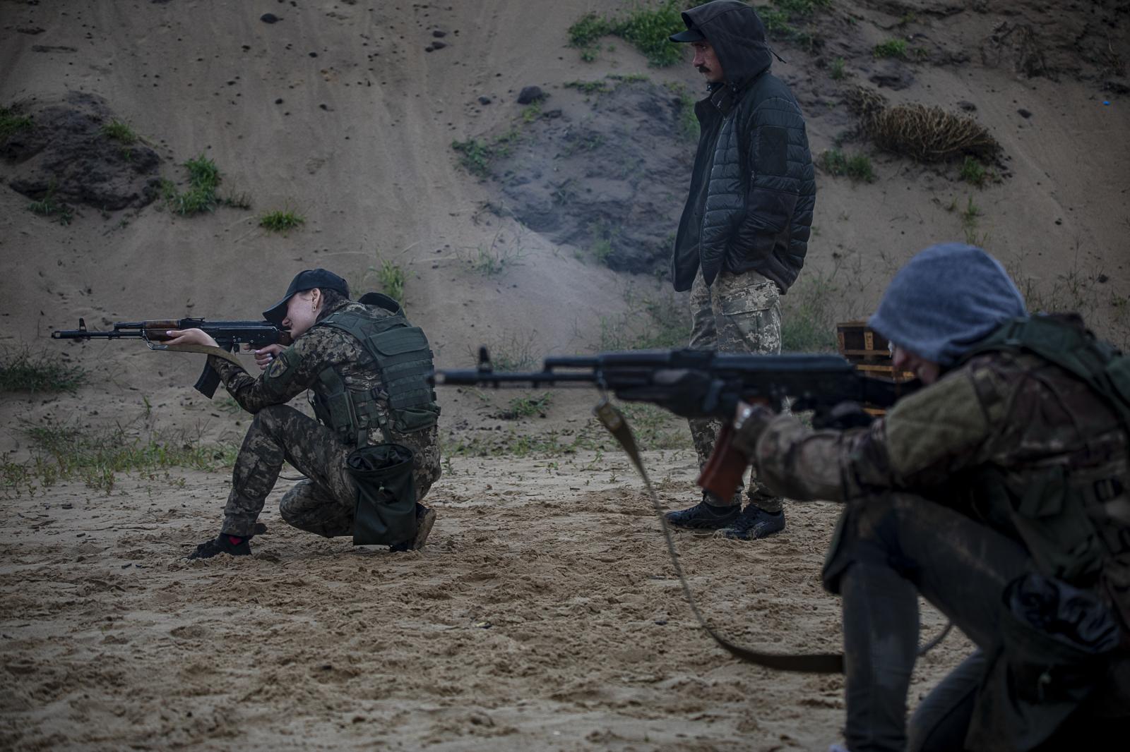 Defenders in training: empowering Ukrainian civilians amidst ongoing war - KYIV, UKRAINE - July 22, 2023: Civilians aim their...