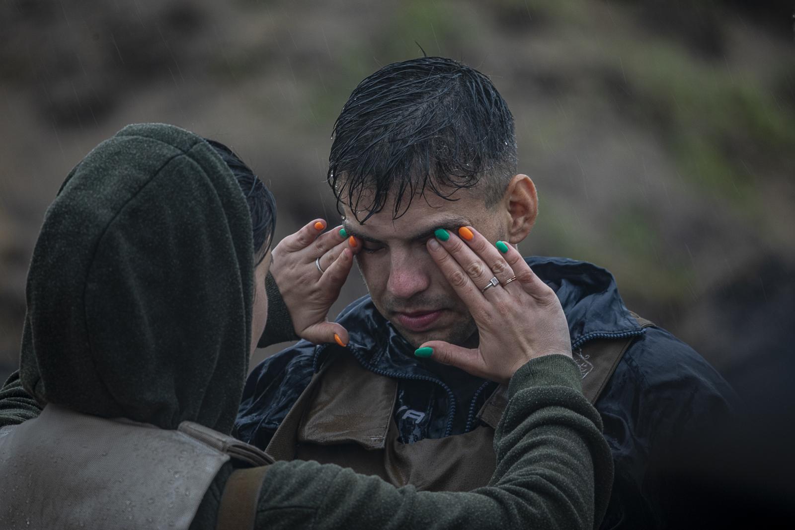 Defenders in training: empowering Ukrainian civilians amidst ongoing war - KYIV, UKRAINE - July 22, 2023: CA woman's hands wipe...
