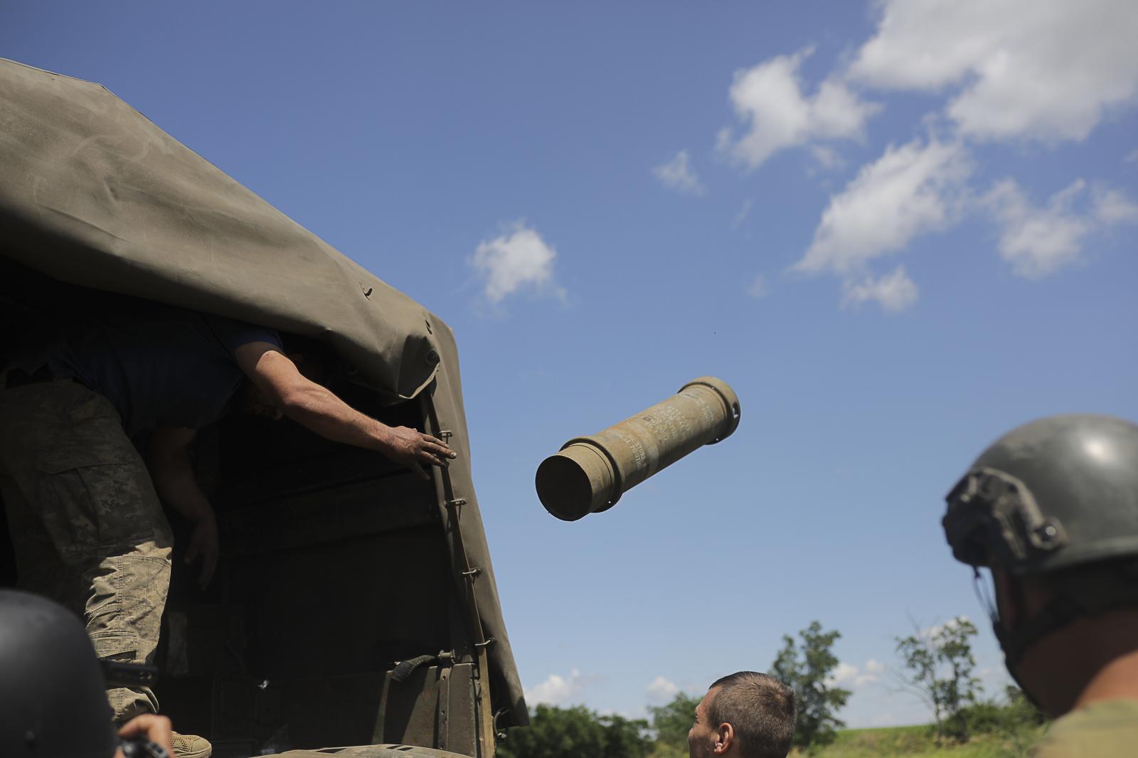Thunderous guardian: the Ukrainian M777 artillery canon on the frontline - ZAPORIZHZHYA REGION, UKRAINE - JULY 16: A soldier creates...