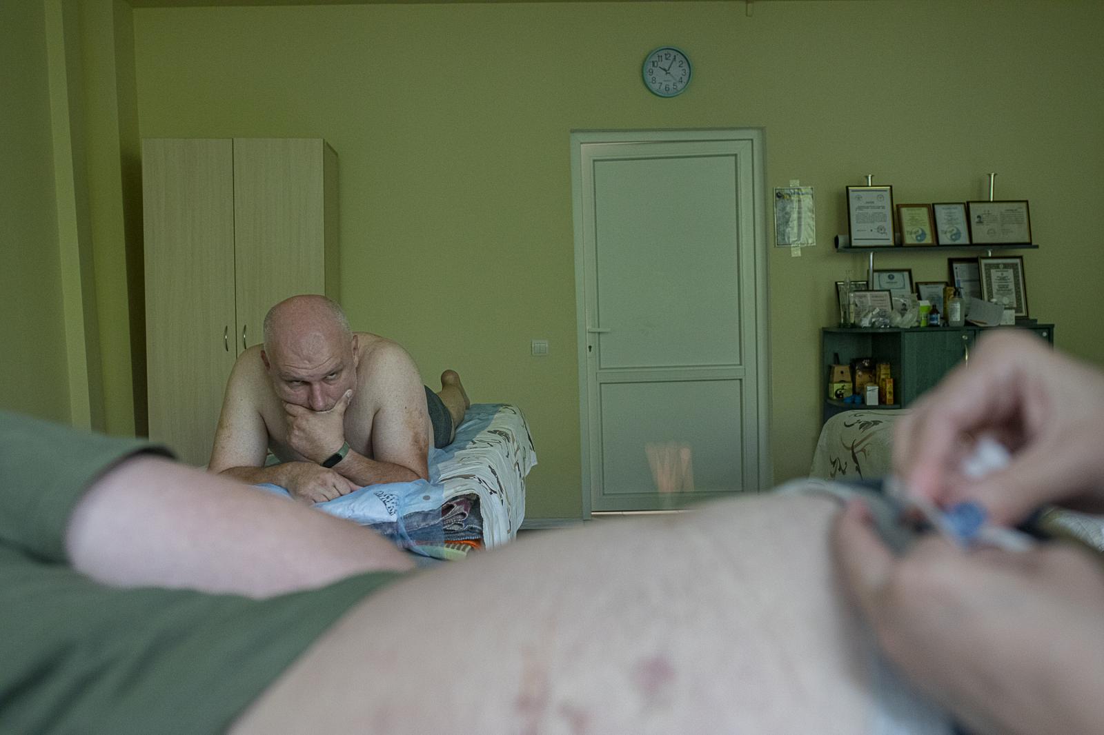 Walking wounded: a journey of recovery and hope - KYIV OBLAST, UKRAINE - JULY 21: A soldier waits his turn...