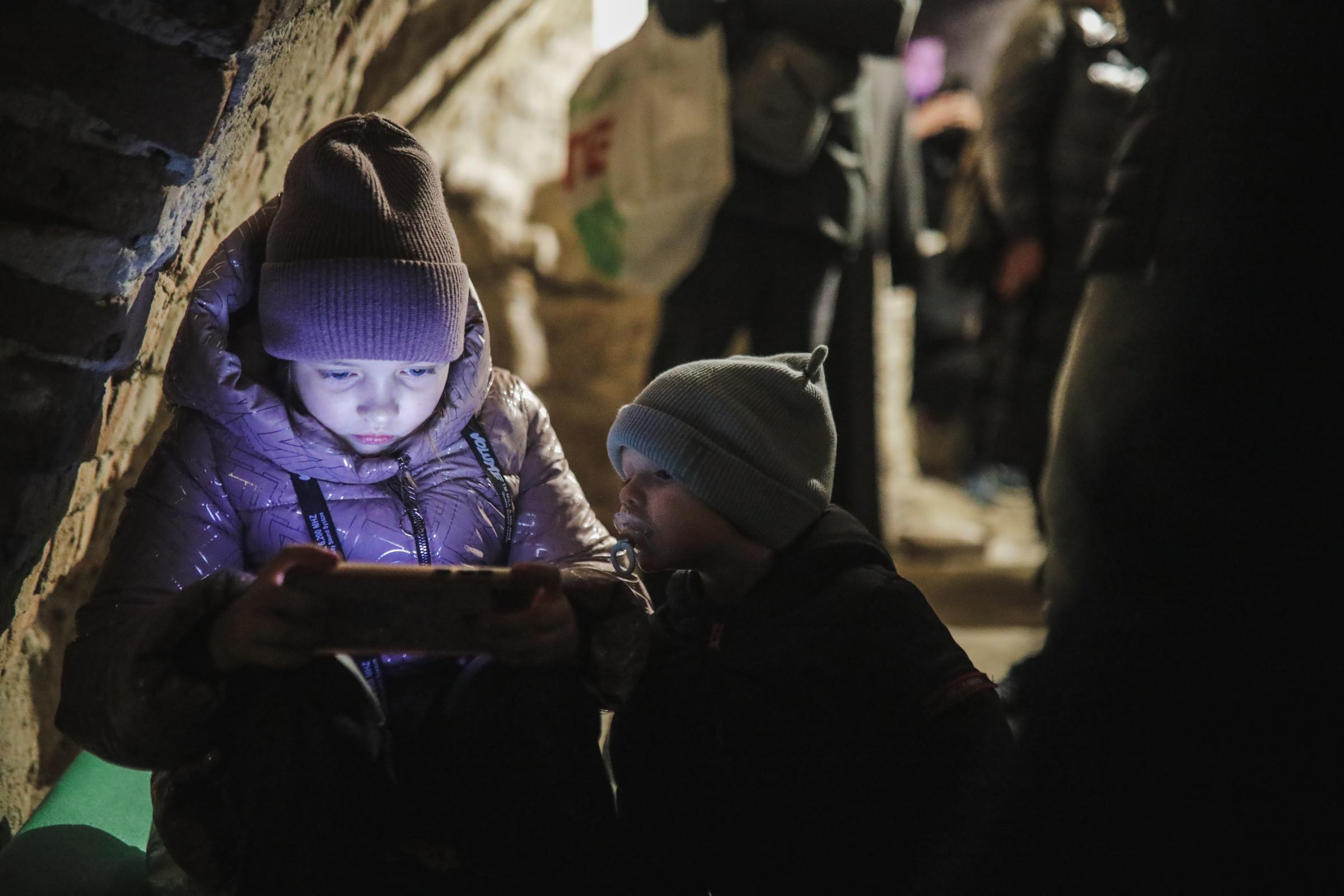Anadolu/Getty Musicians play music in Lviv to comfort people displaced from war zones
