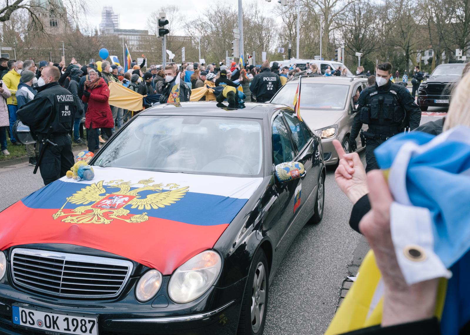 Russian Motorcade in Hanover Blocked - A car with Russian flag encircled by counter-protesters...