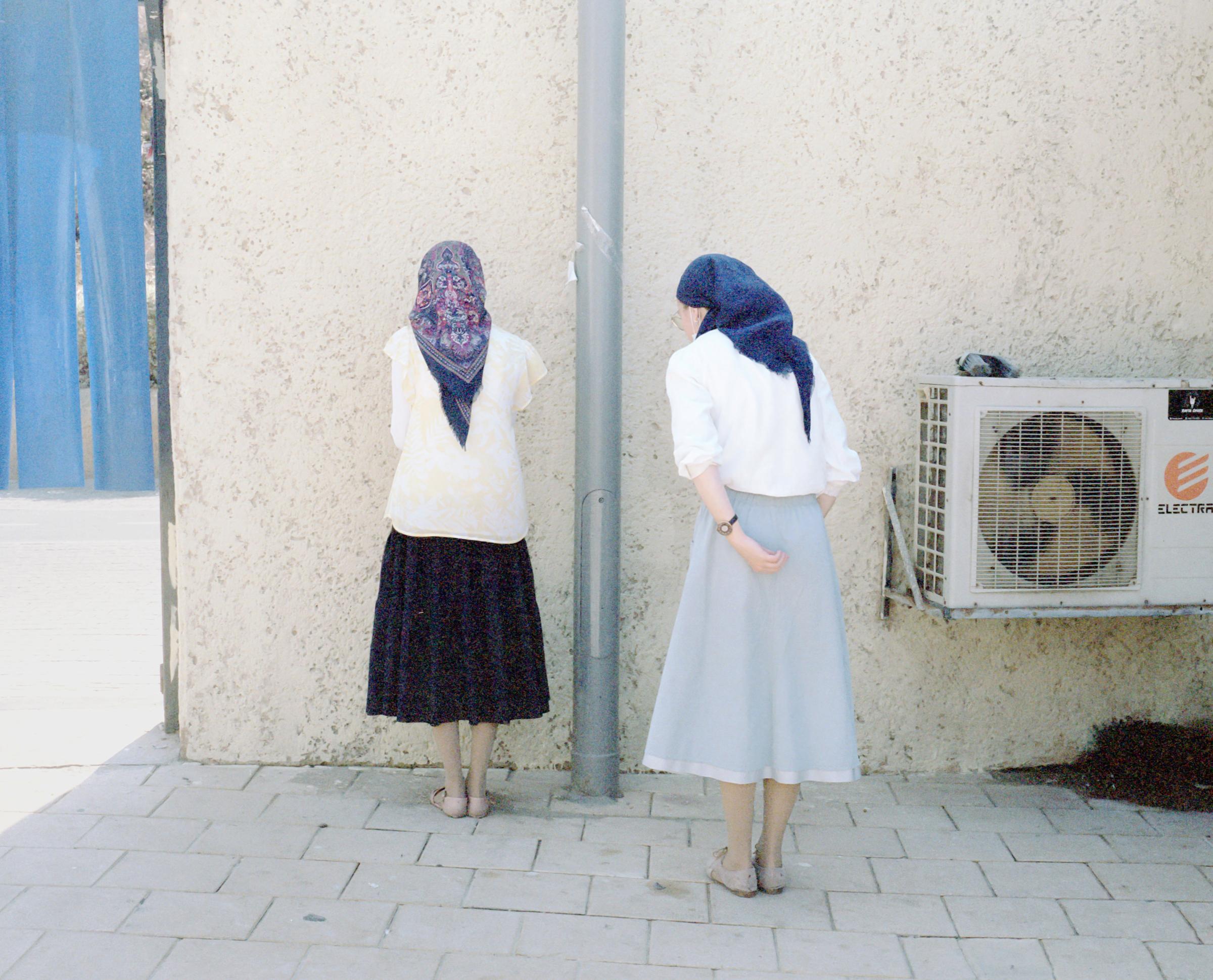 Three Times a Week (ong) - Jewish Orthodox women praying silently.