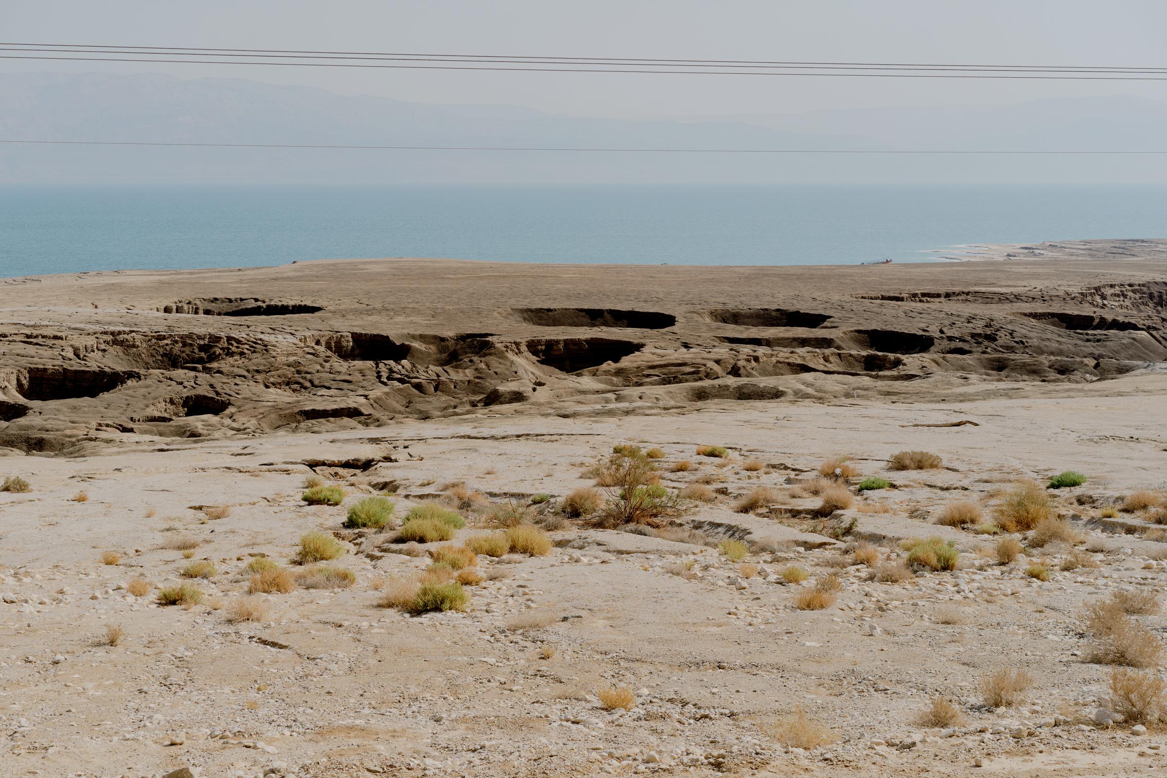 NPR - What is killing the Dead Sea? - Sinkholes near the western shores of the Dead Sea.