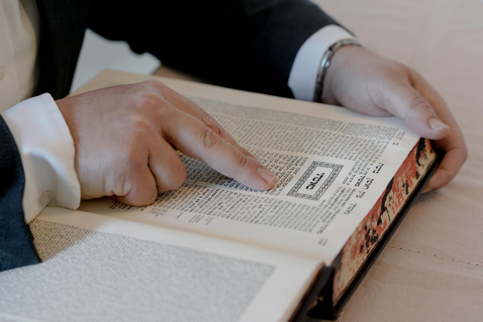 3 May 2023: Yehuda reads a Torah scroll at his home in Elad. 