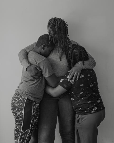 Image from Portfolio - Portrait of Ronisha and her sons in embrace The Bronx 