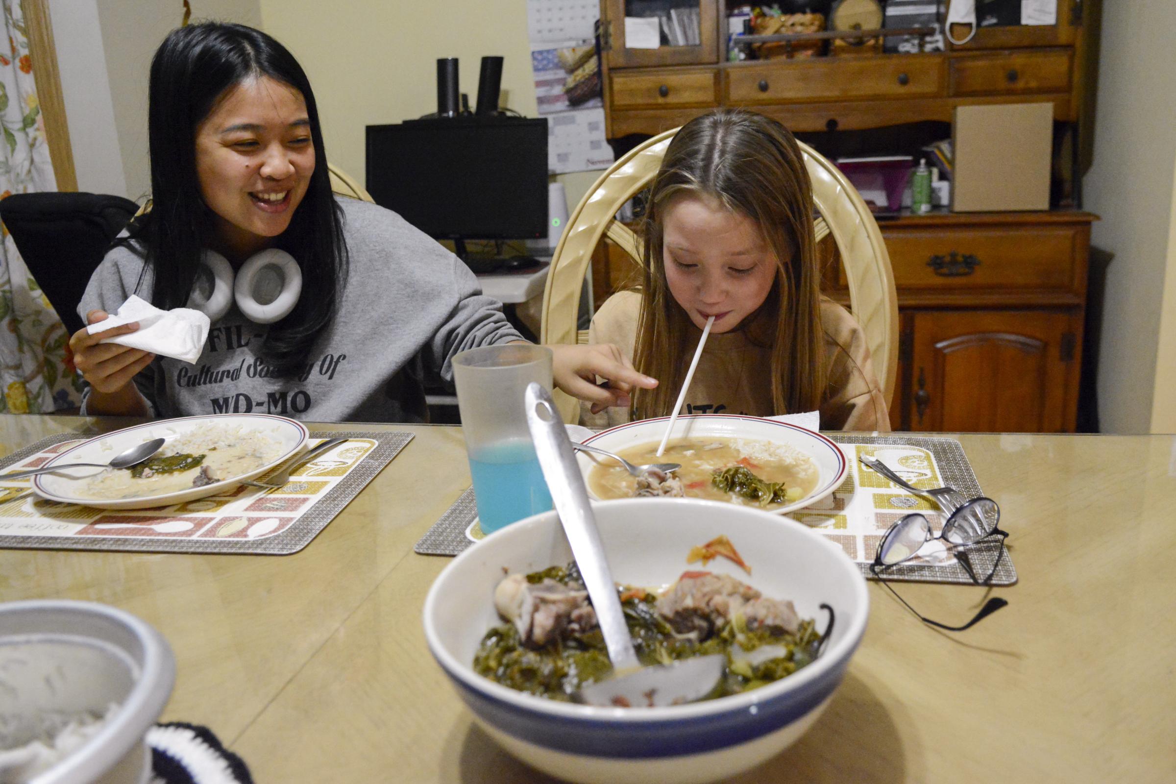 Making noise, breaking tradition - Campbell slurps up her dinner through a straw on Monday,...