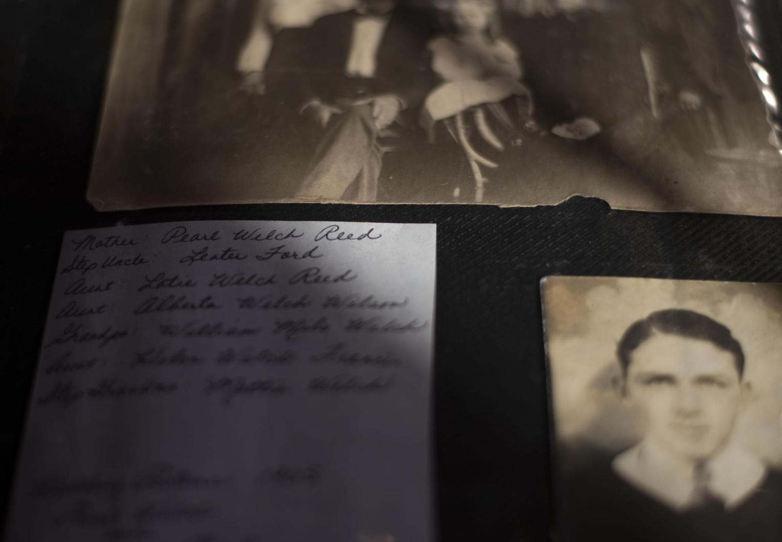 From this earth - The sun illuminates a list of family members included in a photo album Dec. 5. Pearl Welch Reed,...