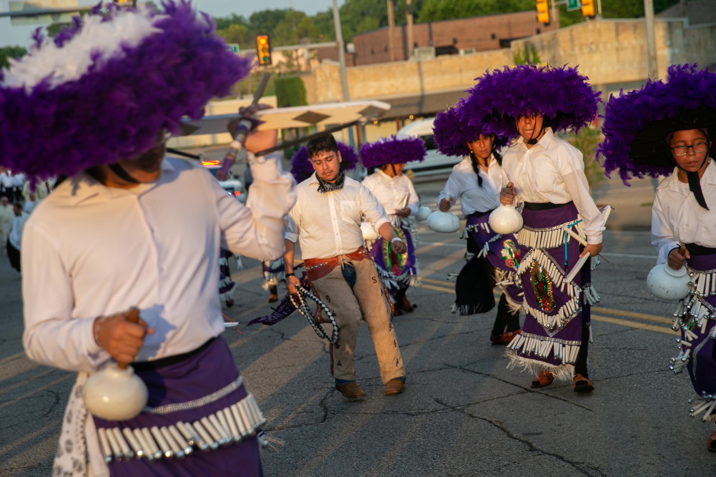 News - Jorge Rosas, center, dances with other members of Danza...