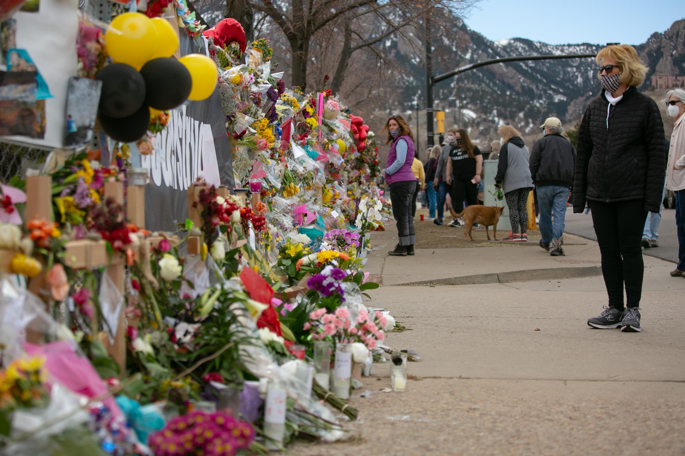 News - Hundreds of mourners lined up along Table Mesa Drive to...