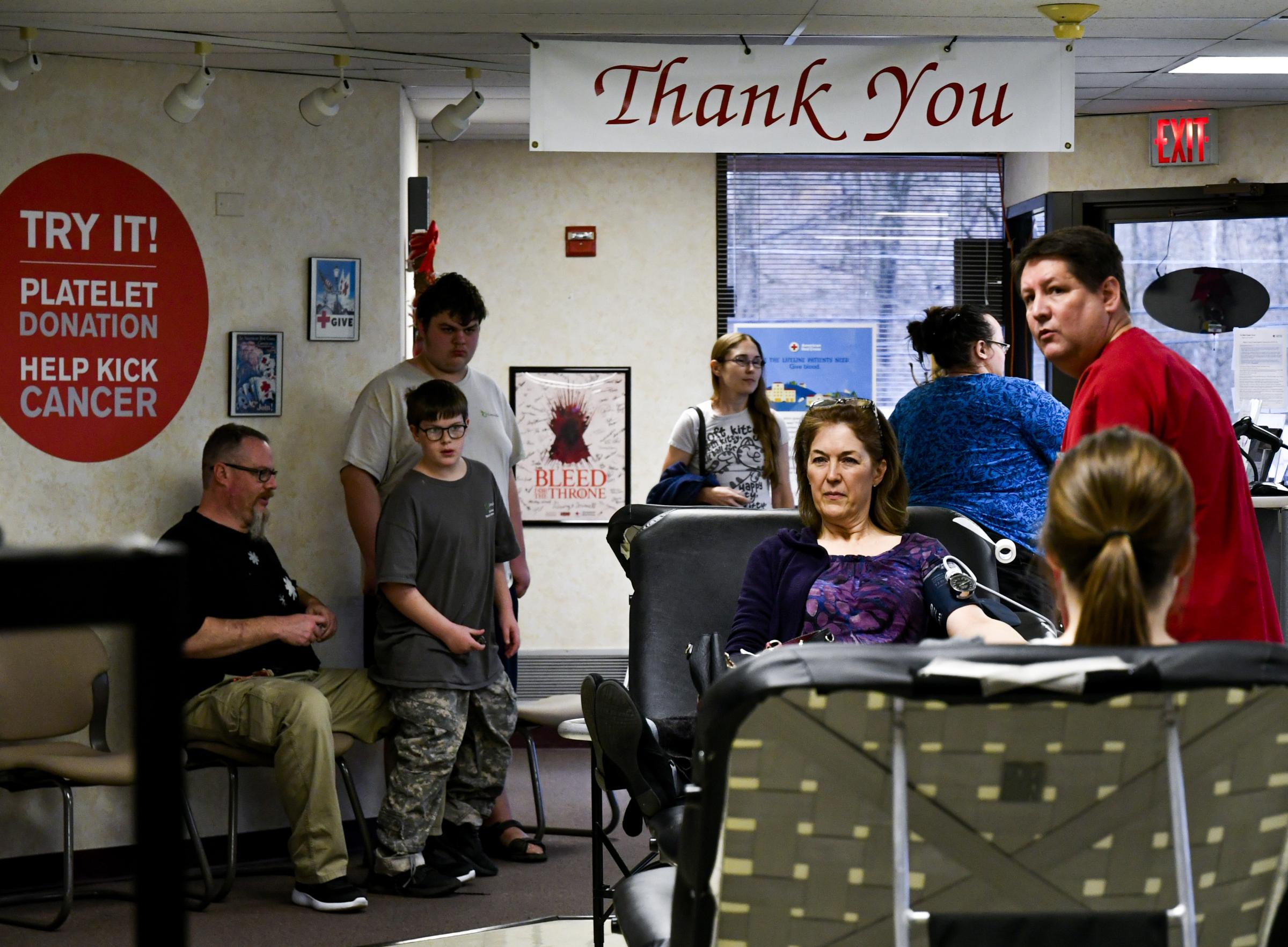 Donation Drives Continue at Red Cross - Potential donors wait to get checked in and their...