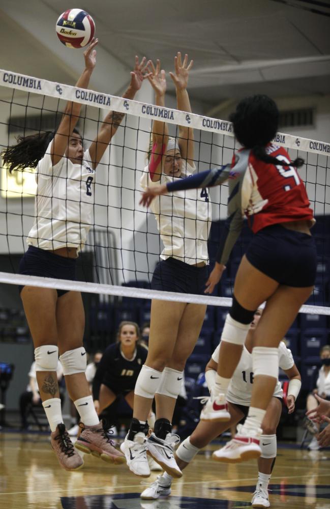 Columbia College sophomore Luisa Ferreira and freshman Ellie Crede attempt a block on Thursday, Sept. 24, 2020, at Columbia College. Columbia beat Hannibal-LaGrange, upping their winning streak to four.