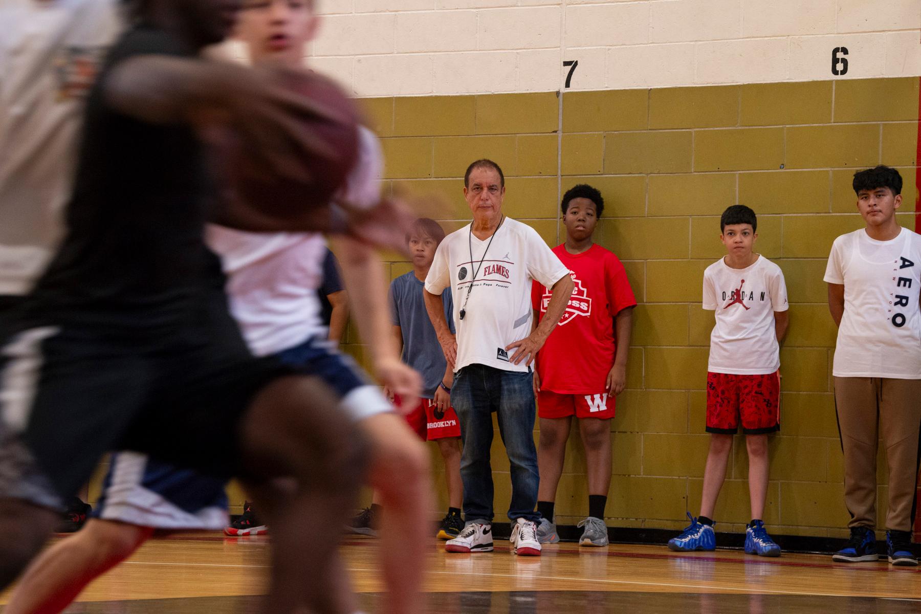Flames 50th Anniversary -  Gerard Papa coaches practice during Flames Youth Basketball tryouts at John Dewey High School,...