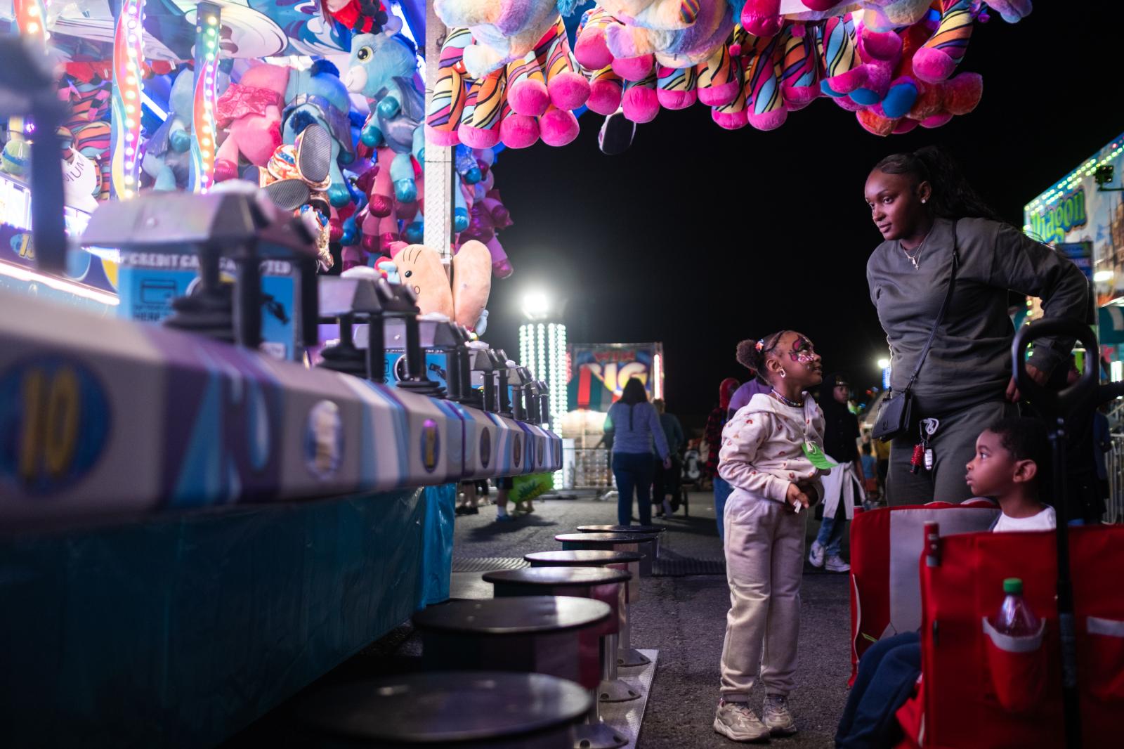 A young girl and her mother at the New York State Fair.&nbsp;