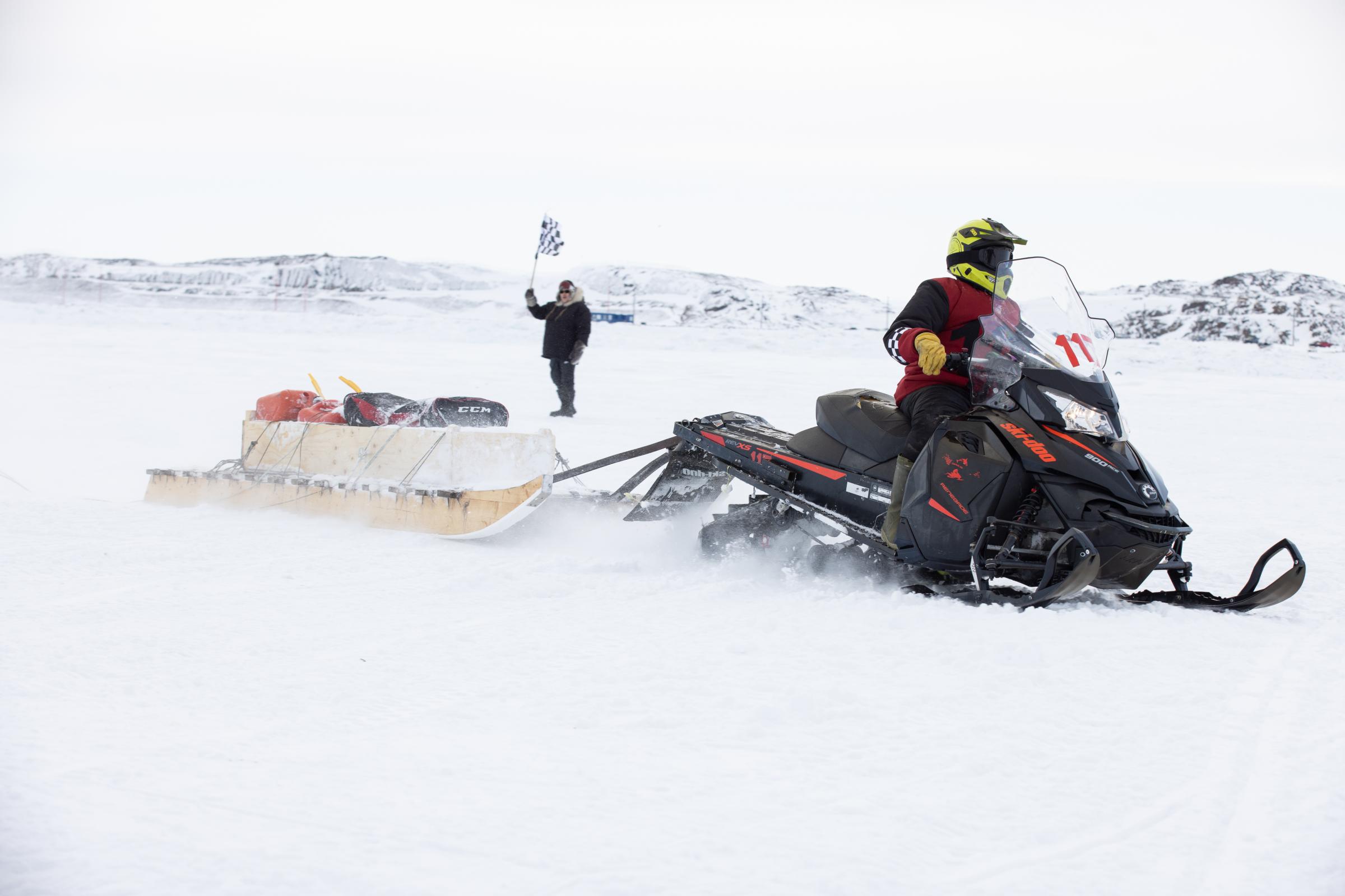 An Arctic blast - Billy Kilabuk is the first to cross the finish line for...
