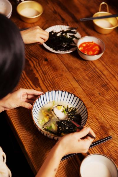 Brooklyn, New York - January 14, 2023: Korean American friends celebrate lunar new year by making Korean traditional foods ddukgook and kimchi in Brooklyn, New York. CREDIT: Mary Inhea Kang for The New York Times Brooklyn The United States