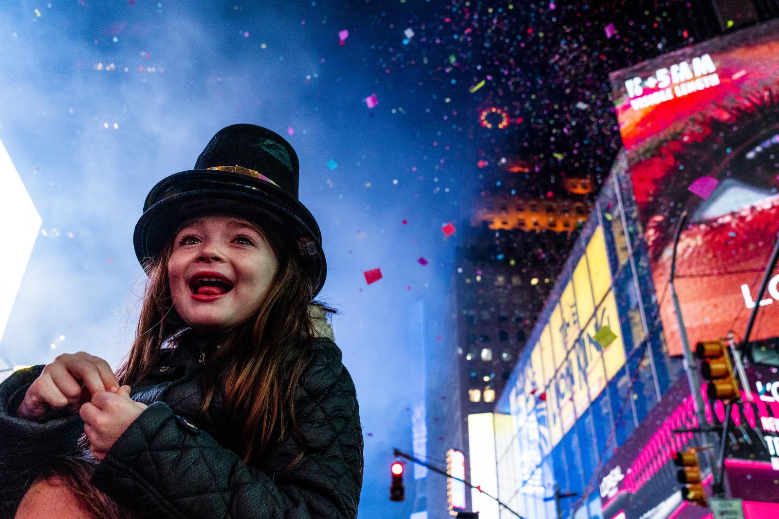A young girl rings in the New Y...in Times Square, New York City.