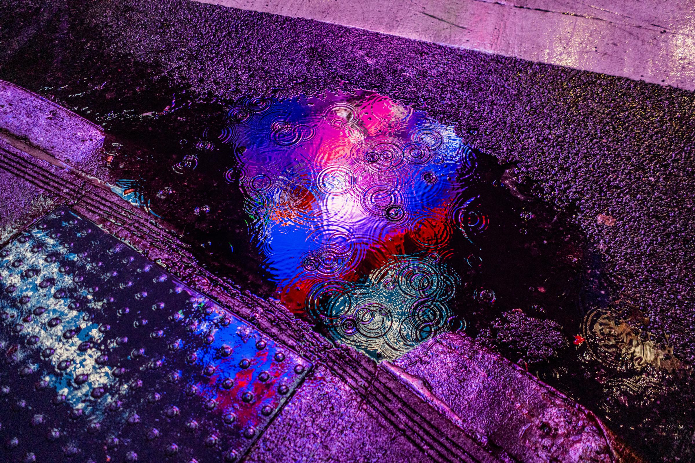 New Year’s Eve in Times Square - Raindrops pool in a puddle during the 2023 New Year's...