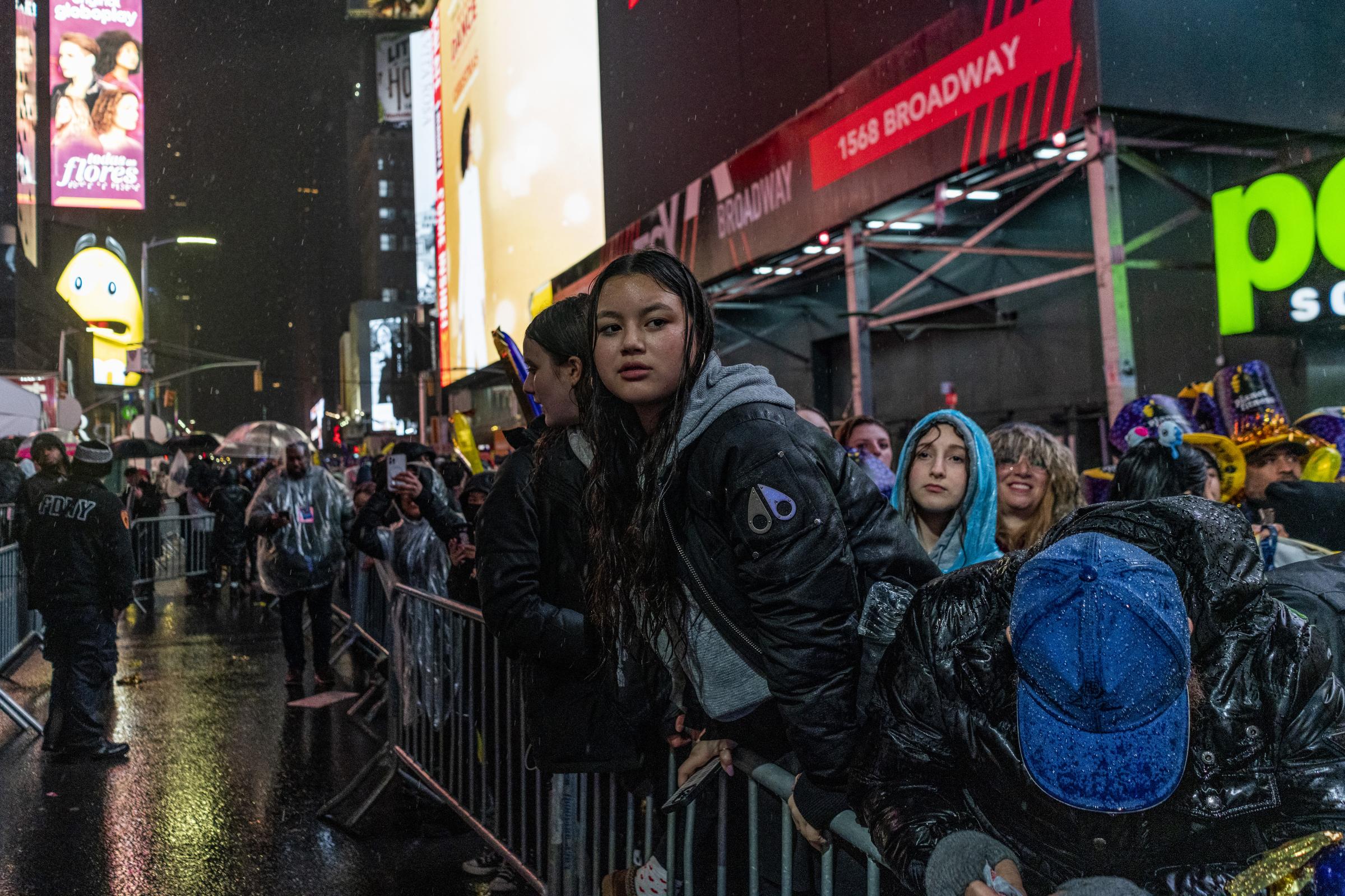 Times Square 2023 NYE Celebration - Spectators endure heavy rain during the 2023 New Years...