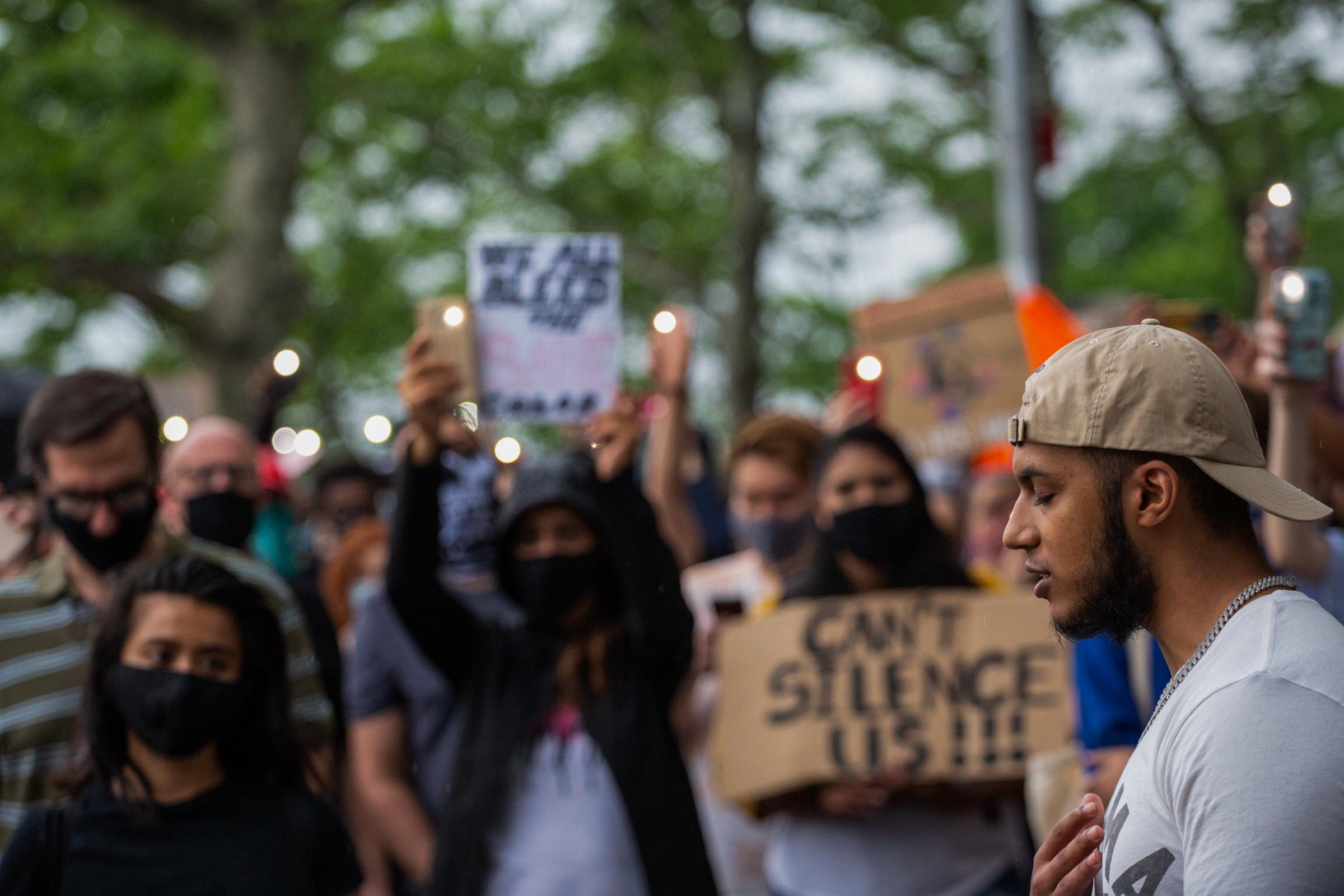 Black Lives Matter Movement 2020 - Navid M. addresses a crowd at a share-out circle during a...