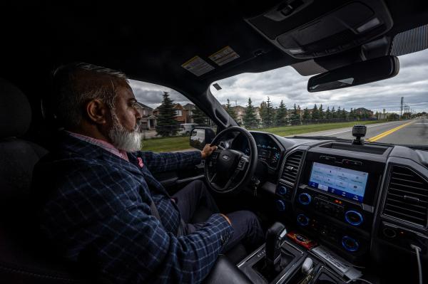 Sukraj Sandhu, a truck driver from Brampton and vice-president of AZ Canadian Truckers Association (AZCTA), drives along the streets of his home in Brampton, ON on October 8, 2022. Sandhu is one of the trucking community advocating for the proposed Highway 413 route along Vaughan to Mississauga.