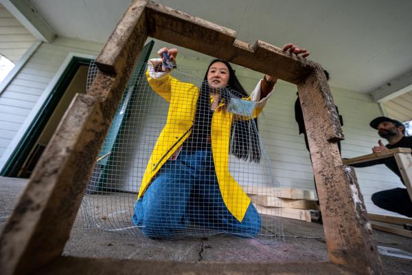 Turtle Protectors - Alice Wang, a new volunteer of Turtle Protectors, helps fix an old turtle nest protector by...