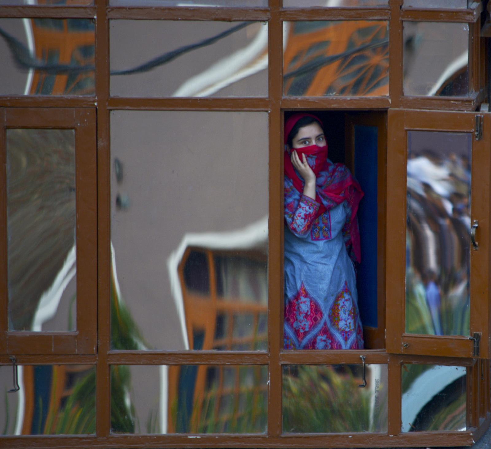 Kashmir Muslim women look towar... district, of Kashmir in Friday