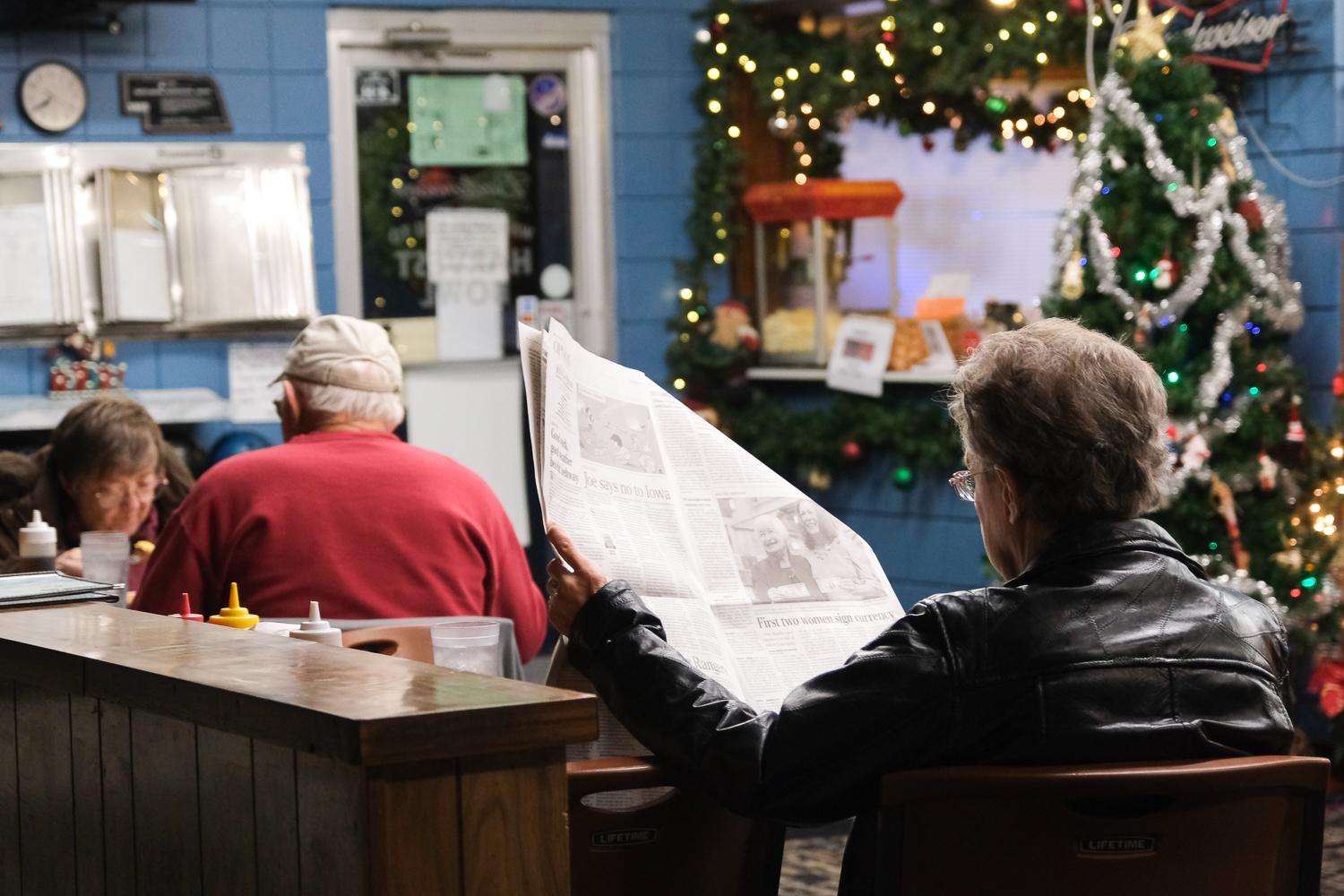 The New York Times - Local residents enjoy breakfast and read the local paper...