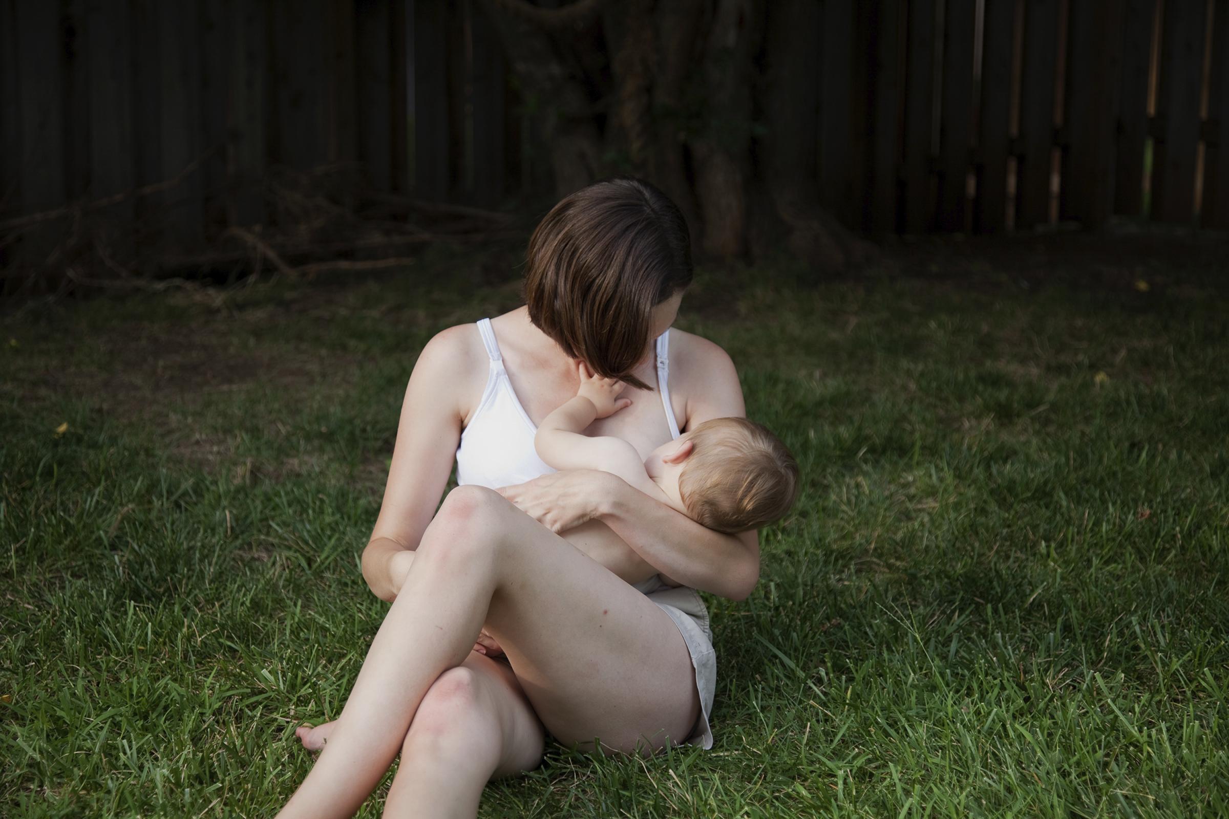 Motherhood and the Military - Jennifer Herbek nurses her son, Isaac, in Leavenworth,...