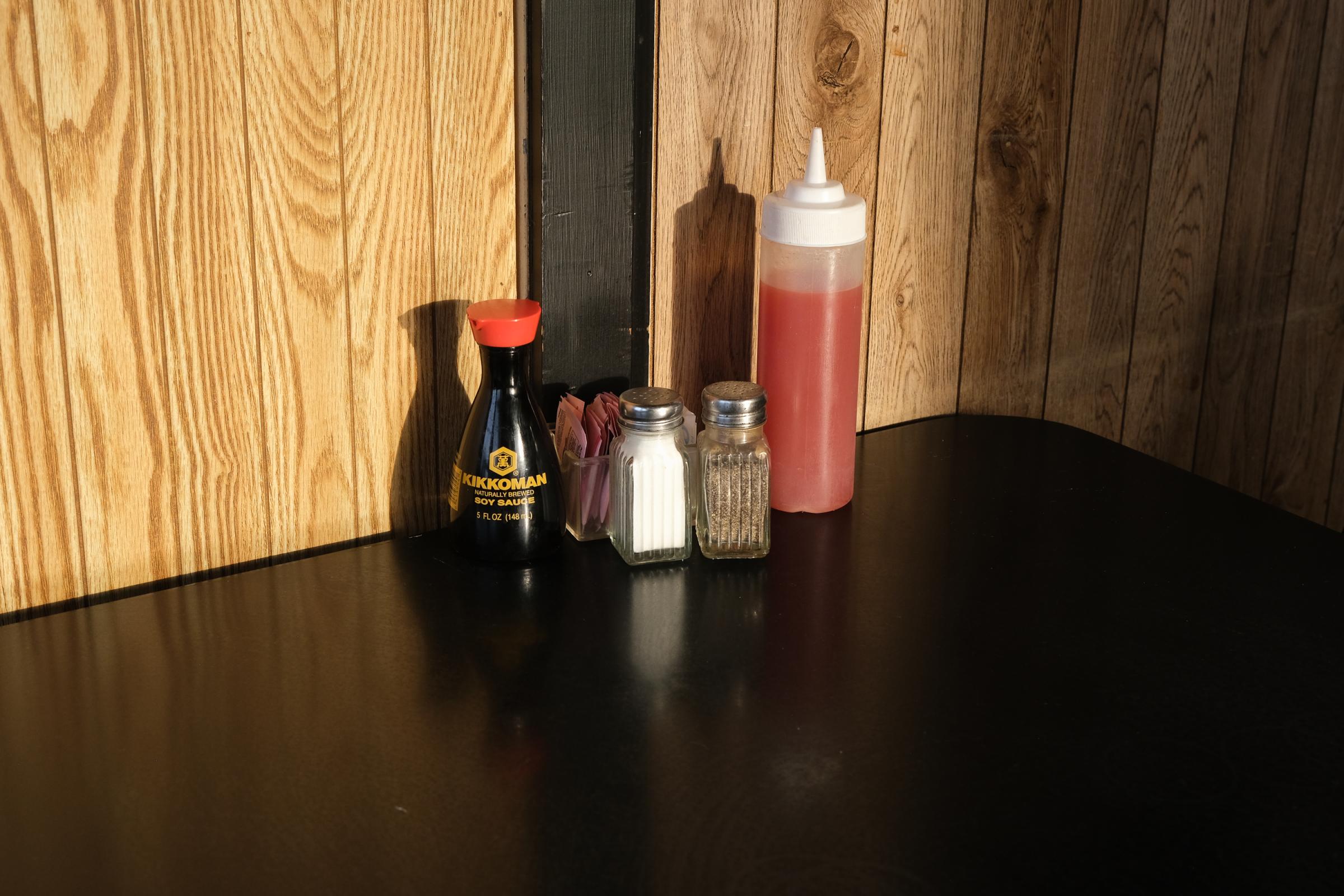 PAPILLION, NE - MARCH 18, 2022: Condiments are set on tables before dinner service inside of Ming&#39;s Restaurant in Papillion, Nebraska on March 18, 2022. (Photo by Arin Yoon for The Washington Post) Papillion United States