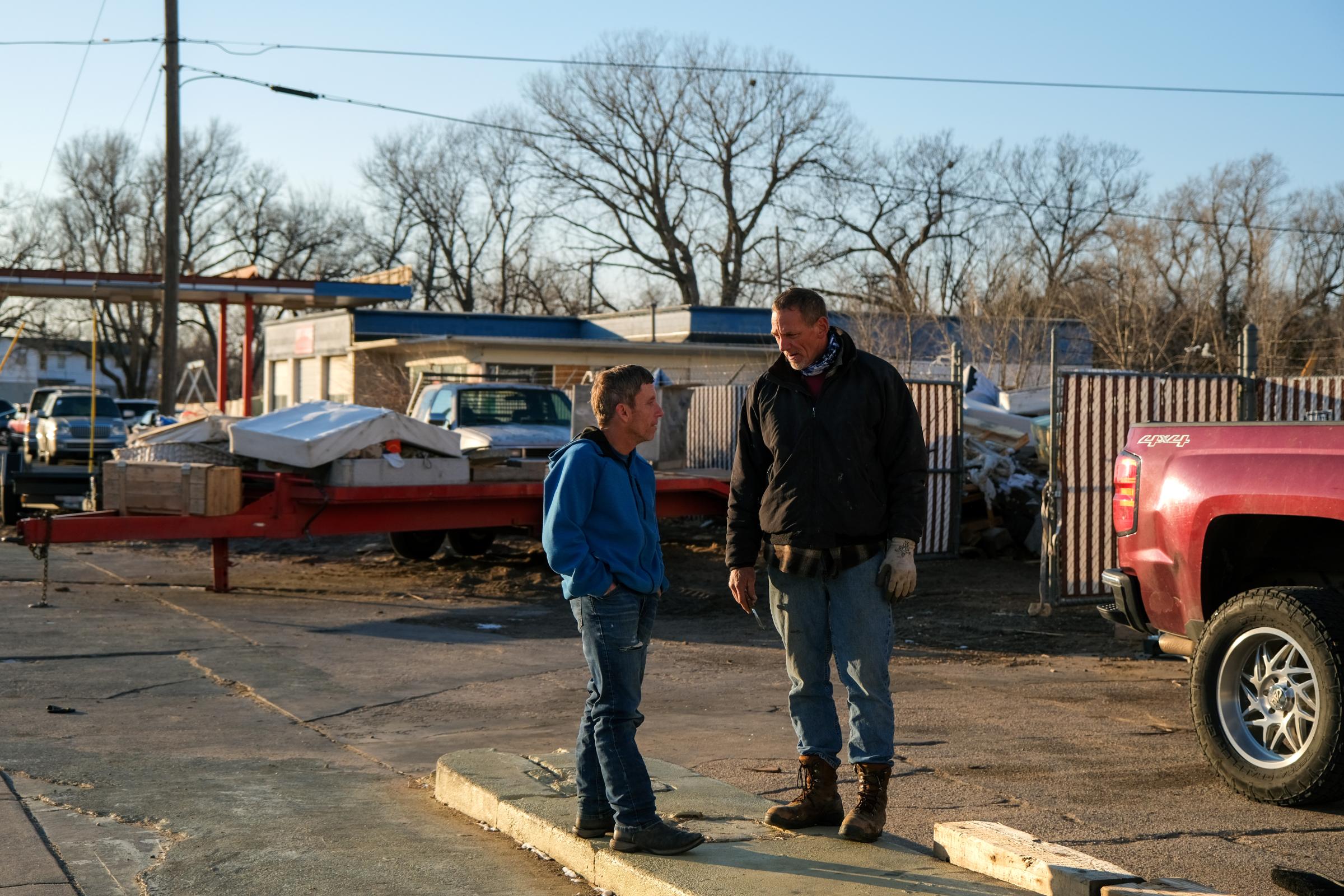 Floyd Bledsoe speaks with one of his employees, another formerly incarcerated man, at his mattress recycling facility in Hutchinson, Kansas, USA on January 15, 2022. Assignment code 20220115InnocentMan Hutchinson USA