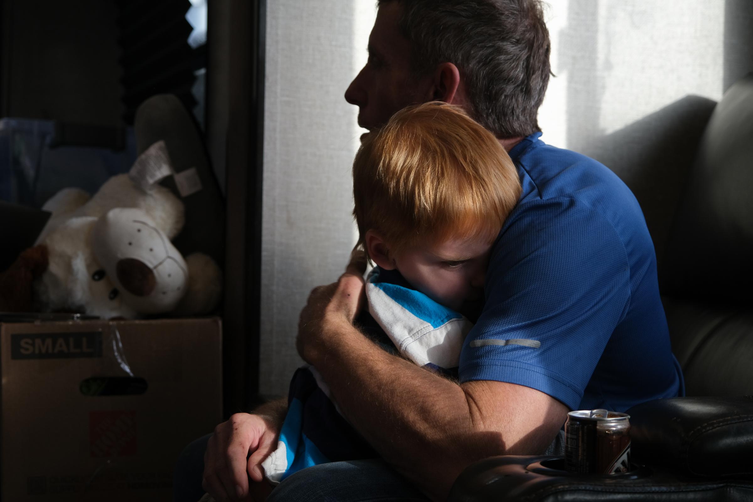 Floyd Bledsoe comforts his son Bryce at their home in Hutchinson, Kansas, USA on January 15, 2022. Assignment code 20220115InnocentMan Hutchinson USA