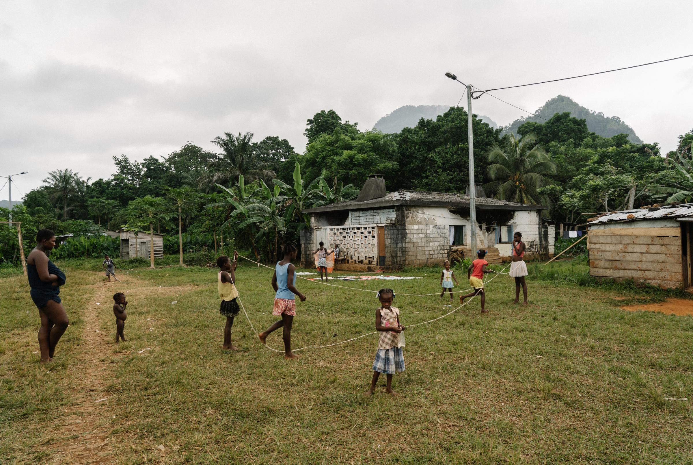 Genetic Engineering In the Mosquito War - Children play skipping rope on the island of...