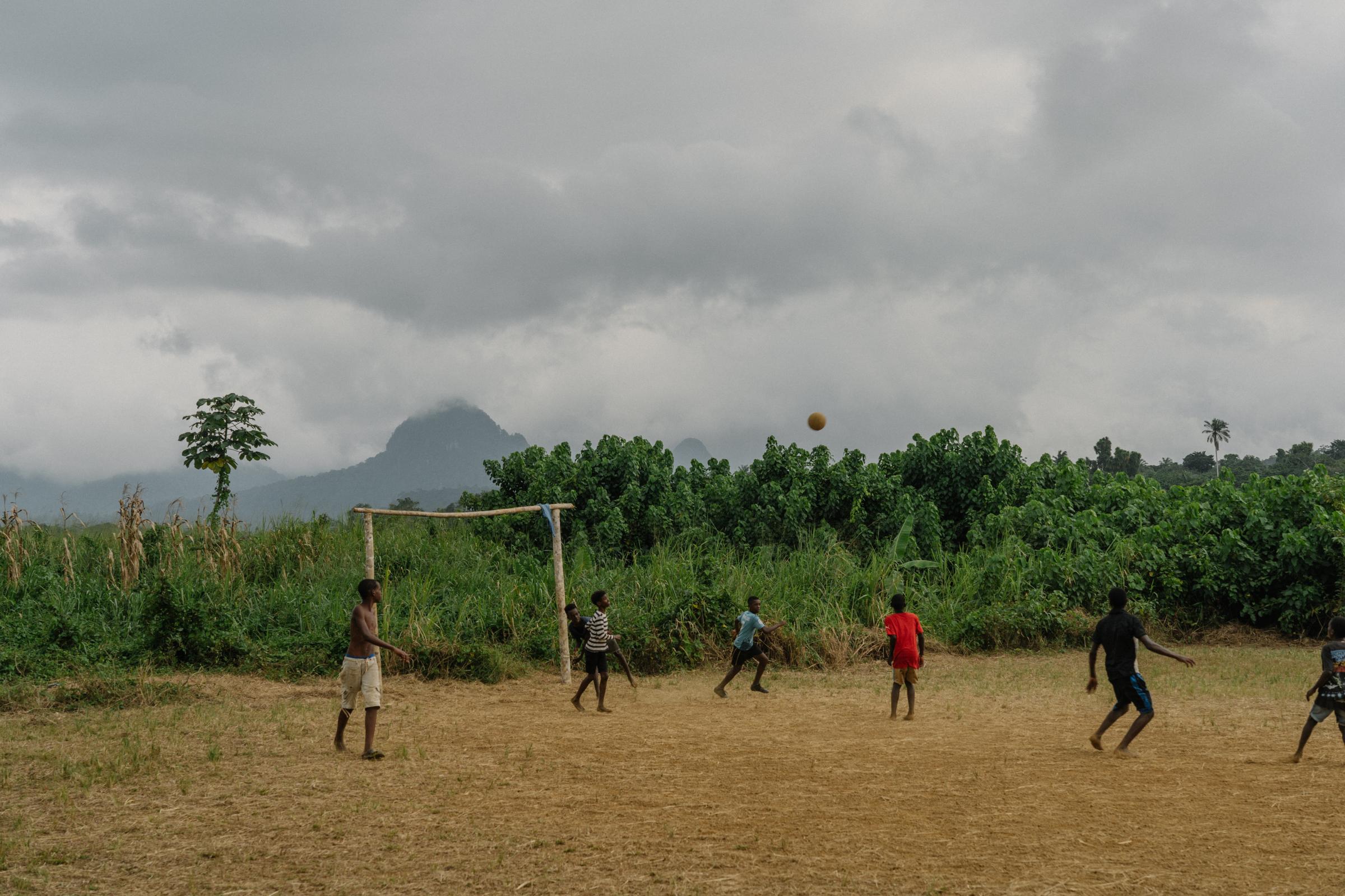 Genetic Engineering In the Mosquito War - Kids play football on the island of Príncipe on...