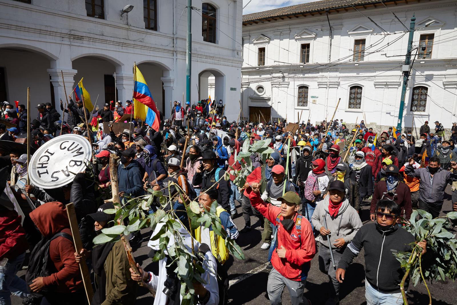 Thousands of people take to the streets of downtown Quito.