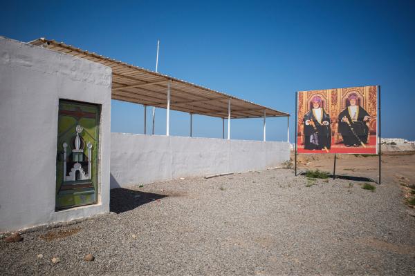 In Oman, a Dagger Symbolizes National Pride - SUR, OMAN-&shy;‐ NOVEMBER 21, 2022: A road side mosque poster of the former Sultan of Oman...
