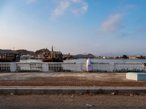 In Oman, a Dagger Symbolizes National Pride - SUR, OMAN-&shy;‐ NOVEMBER 22, 2022: A dhow owner watch his boat come into shore. As the tide...